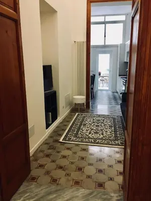 a hallway with a door leading to a living room at CLUVERIO11 LUXURY APARTMENT in Palermo