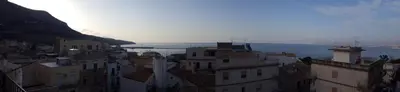 a group of buildings in front of a body of water at Mare e Relax in Castellammare del Golfo