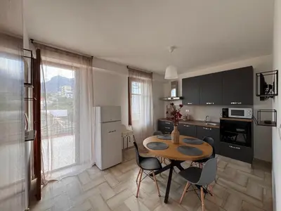 a kitchen with a table and chairs in a room at Mare e Relax in Castellammare del Golfo