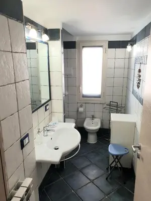 a bathroom with a sink and a toilet at Casa Maro' in Palermo