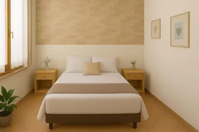 a bedroom with a large bed with two night stands at Appartamenti Penelope in Mondello