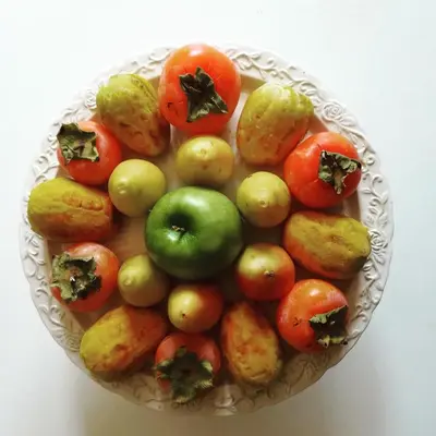 a bowl of tomatoes and other vegetables on a table at La stanza di Angi a Mondello in Palermo