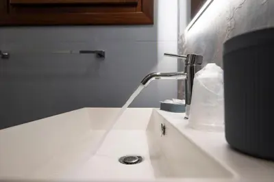 a sink with a faucet in a bathroom at Room & Breakfast Aloe in San Vito lo Capo