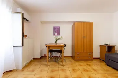 a small room with a table and a cabinet at GuestHost - Palermo Functional Studio in Palermo
