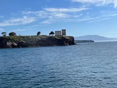 a house on an island in the water at Le Tre Rose in Terrasini