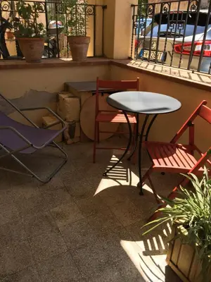 a table and two chairs and a table and chairs at Al Baglio low cost in Palermo