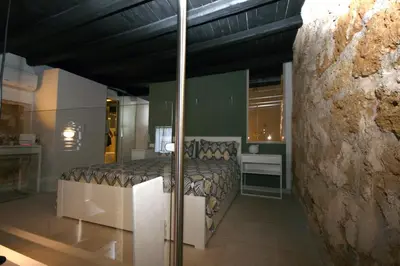 a bedroom with a bed in a room at La Vecchia Stalla in Palermo