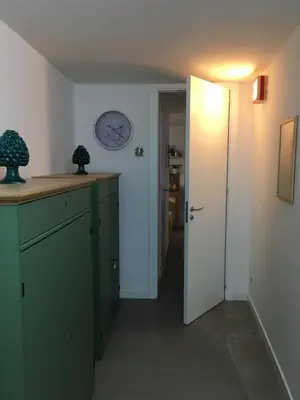 a kitchen with green cabinets and a white door at Like Home Palermo in Palermo