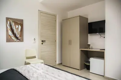 a bedroom with a bed and a sliding door at Amarillo in Palermo