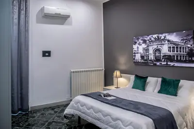 a bedroom with a bed with a painting on the wall at Amarillo in Palermo