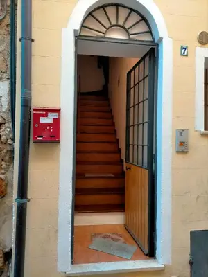 a door leading to a stairway with a set of stairs at A casa SCALILLA in Palermo