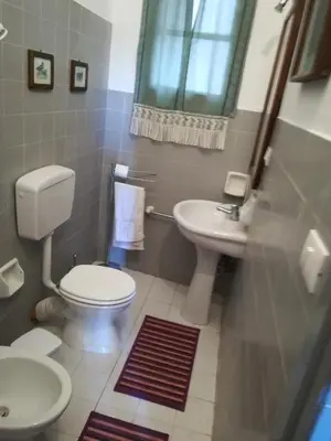 a bathroom with a toilet and a sink at Casa in palazzo Graffeo Sven in Palermo