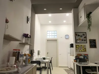 a kitchen with a table and a dining room at centruMassimo b&b in Palermo