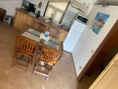 an aerial view of a kitchen with a table and a refrigerator at MARE AZZURRO in Campofelice di Roccella