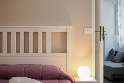 a bedroom with a bunk bed and a lamp at Il Tarì Apartment in Palermo