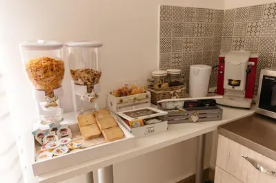 a counter with food and other items on it at Il Tarì Apartment in Palermo