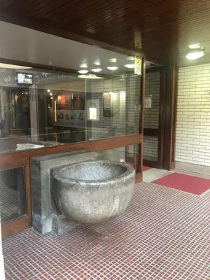 a large stone tub sitting in a room at Suite Vera in Palermo