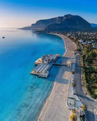 an aerial view of a beach with a resort at Mondello's Pearl in Mondello