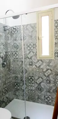 a bathroom with a shower with a glass door at Apartament Home Lory in Palermo