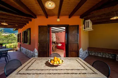 a table with a bowl of fruit on top of it at Villa Thyrrenia in Castellammare del Golfo
