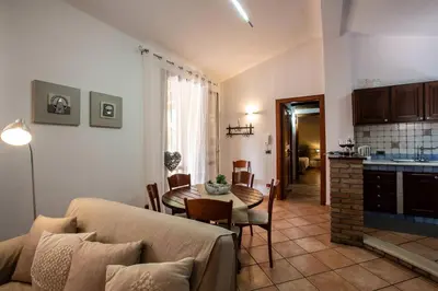 a living room with a couch and a table at Villa Isabella in Castellammare del Golfo