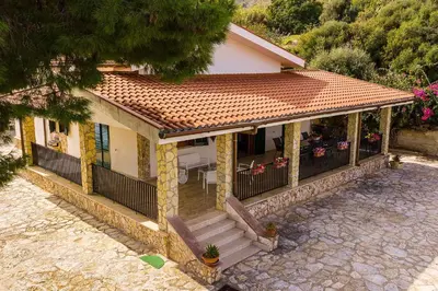 a small house with a porch and a balcony at Villa La Randa in Castellammare del Golfo