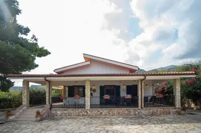 a house with a porch and a patio at Villa La Randa in Castellammare del Golfo