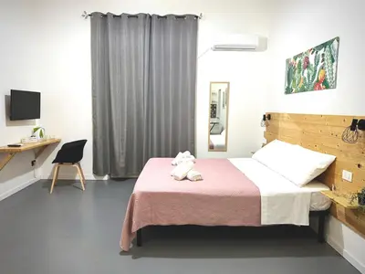 a bedroom with a bed with a teddy bear on it at Marilù in Palermo