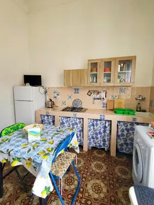 a bedroom with a bed and a table with food on it at Case Vacanze Gabry in Castellammare del Golfo