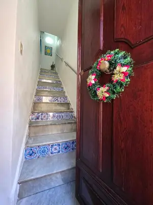 a staircase with blue and white tiles on the stairs at Case Vacanze Gabry in Castellammare del Golfo