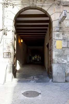 a tunnel in a building with a man hole in it at Amunì in Palermo