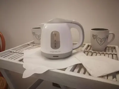 a coffee maker and two cups on a table at Amunì in Palermo