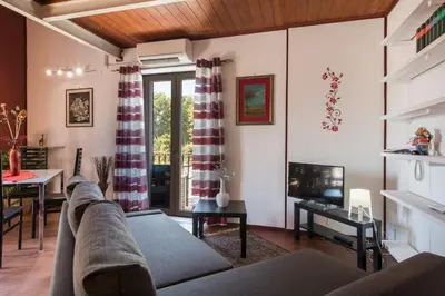 a living room with a couch and a table at The Normans Apartments in Palermo