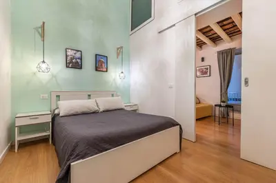 a bedroom with a bed in a room at Casa Abbanniata a Ballaro' by Wonderful Italy in Palermo