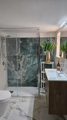 a bathroom with a shower and a toilet and a sink at All'Ombra di Porta Nuova in Palermo