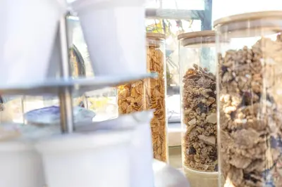 a group of glass jars filled with different types of food at I Mori di Porta Nuova Suite & Terrace in Palermo