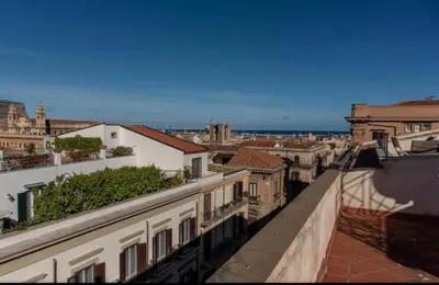 a view of a city from the roof of a building at Appartamento Palazzo Pace al Cassaro in Palermo