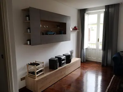 a living room with a counter with three microwaves at A casa di Zara in Termini Imerese