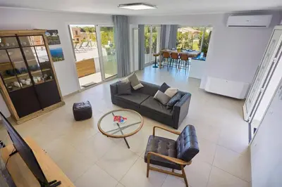 a living room with a couch and chairs and a table at Villa Biancolilla in Castellammare del Golfo