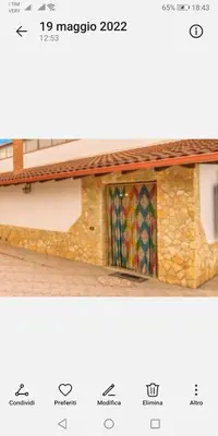 two pictures of a building with a tile roof at RESORT Valle del Re in Partinico