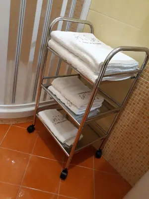 a towel rack with towels on it in a bathroom at A casa di Simona in Monreale
