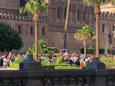 a crowd of people standing in front of a building at ALBA DEL CAPO in Palermo