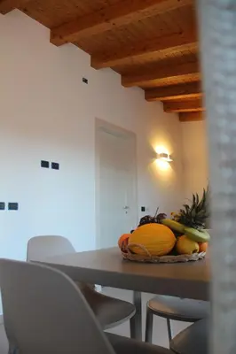 a table with a bowl of fruit on top of it at Mamiani Suite in Castellammare del Golfo