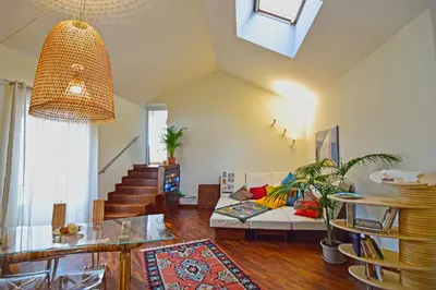 a living room with a couch and a table at Casa Santa Sofia in Palermo