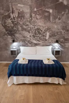 a bedroom with a bed with two towels on it at Ai Tre Mercati in Palermo