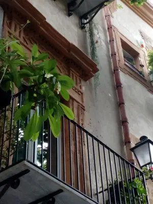 a balcony of a building with a window at Arimatea Accommodations in Palermo