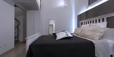 a bedroom with a bed with two pillows on it at SpAsimoH-2 in Palermo