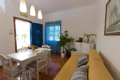 a living room with a couch and a table at La Marsa Vacances in Mondello
