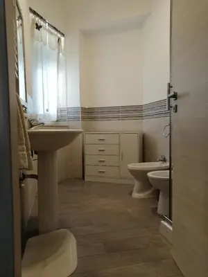 a bathroom with a sink and a toilet at Casagioiosa18 in Palermo