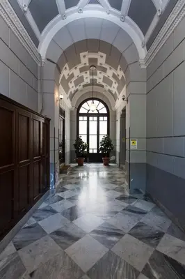 an empty hallway of a building with a ceiling at casa mo room and suite in Palermo